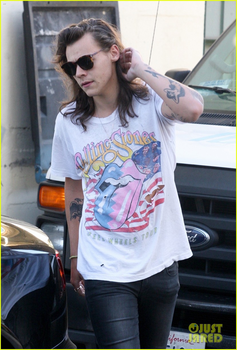 harry styles sports vintage style while shopping at saint laurent 02