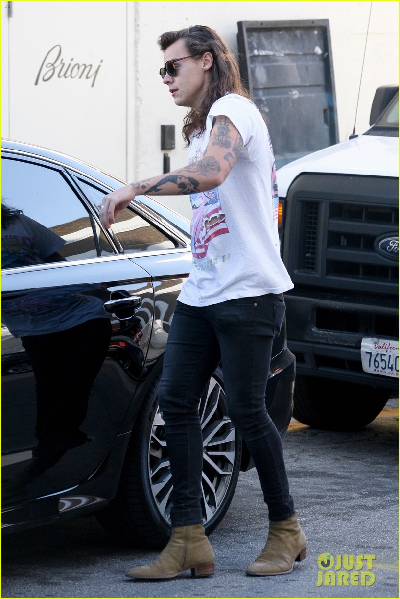 harry styles sports vintage style while shopping at saint laurent 12