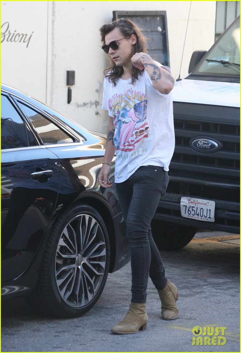 harry styles sports vintage style while shopping at saint laurent 16