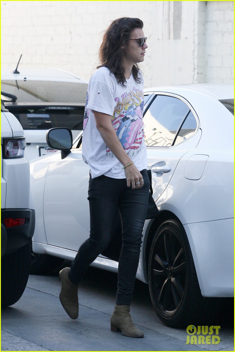 harry styles sports vintage style while shopping at saint laurent 17
