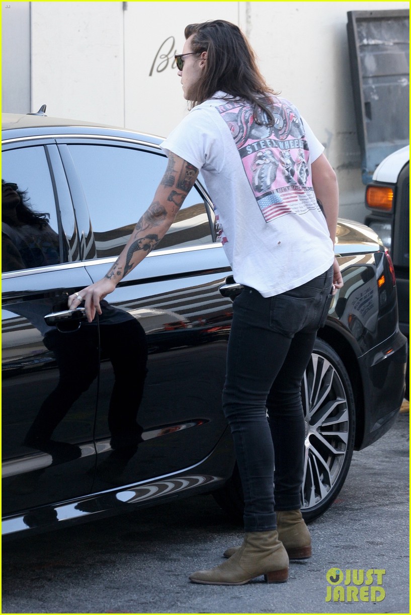 harry styles sports vintage style while shopping at saint laurent 18