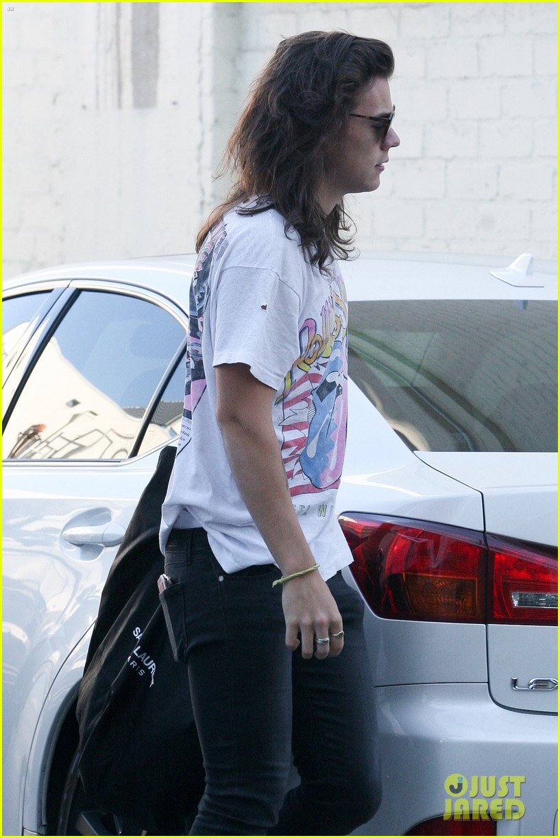 harry styles sports vintage style while shopping at saint laurent 21