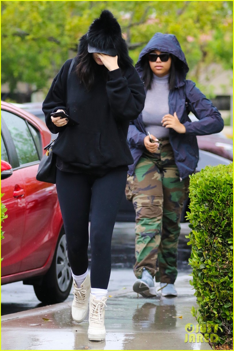 Kendall Jenner sports a hoodie and leggings as she braves the rain