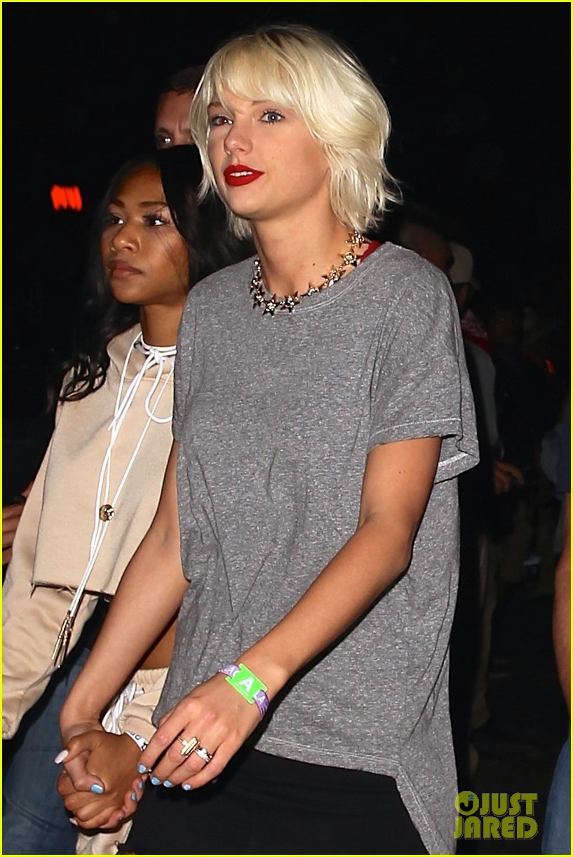 taylor swift is platinum blonde at neon carnival with karlie kloss 03