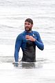 liam hemsworth strips out of his wetsuit after a surfing session 05