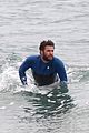 liam hemsworth strips out of his wetsuit after a surfing session 07