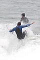 liam hemsworth strips out of his wetsuit after a surfing session 08