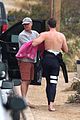 liam hemsworth strips out of his wetsuit after a surfing session 14