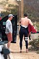liam hemsworth strips out of his wetsuit after a surfing session 17
