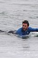 liam hemsworth strips out of his wetsuit after a surfing session 19