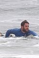 liam hemsworth strips out of his wetsuit after a surfing session 29