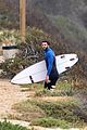 liam hemsworth strips out of his wetsuit after a surfing session 33