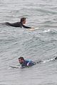 liam hemsworth strips out of his wetsuit after a surfing session 39