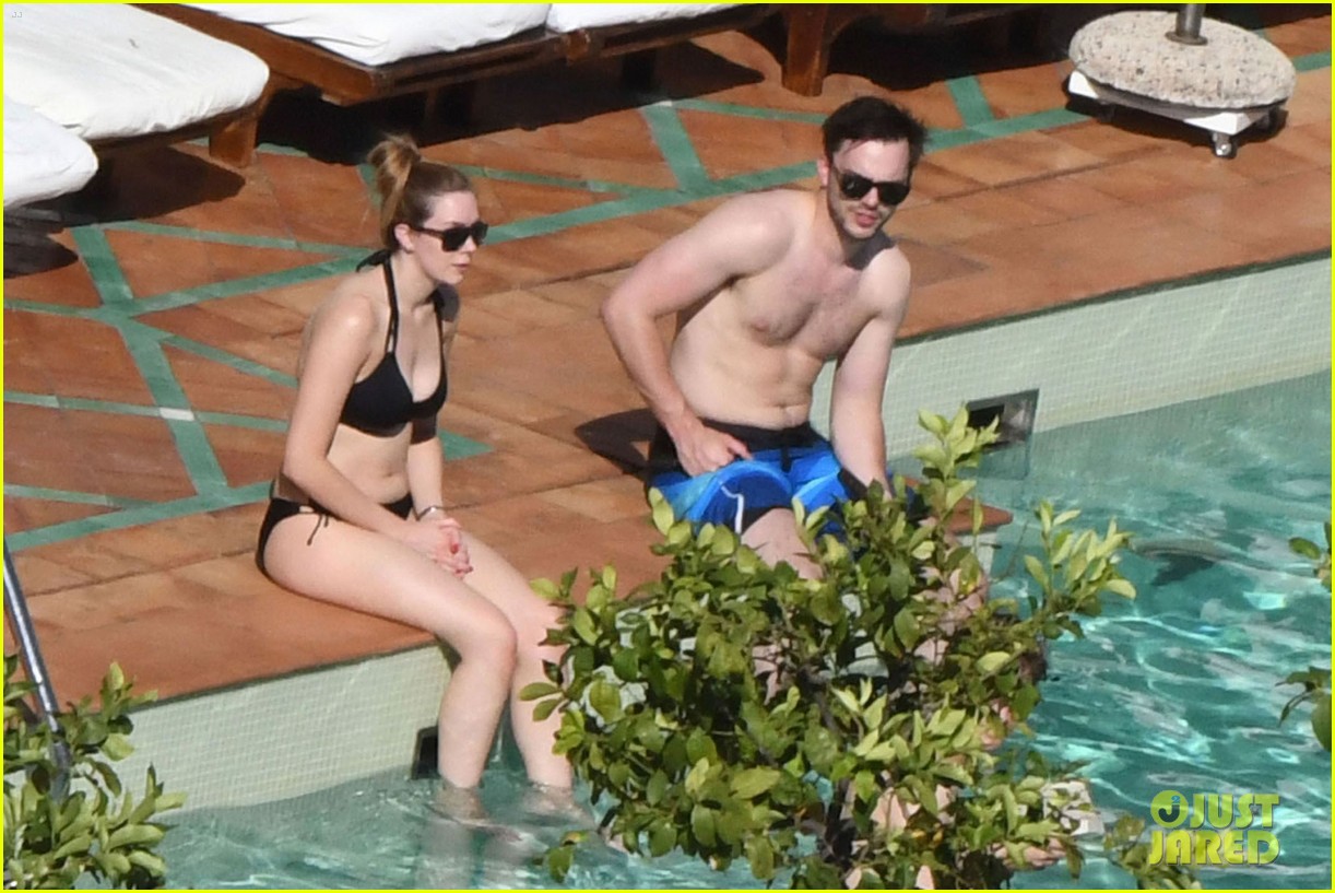 nicholas hoult shirtless by the pool 01