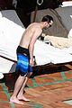 nicholas hoult shirtless by the pool 26