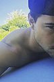taylor lautner goes shirtless for pool day selfie