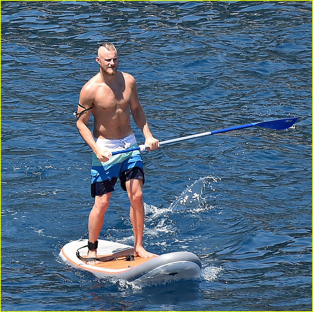alexander ludwig goes shirtless while working out in italy 02