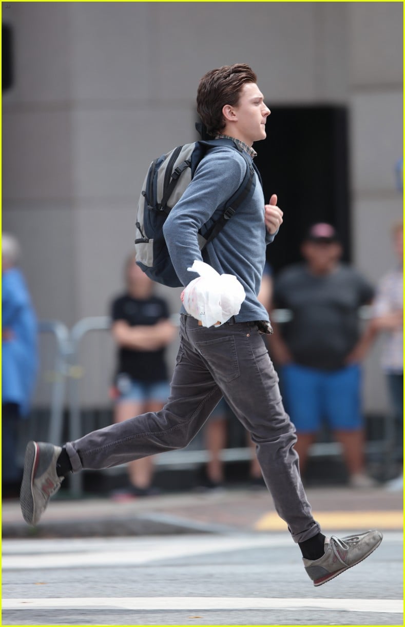 tom holland suits up on the set of spider man homecoming 12