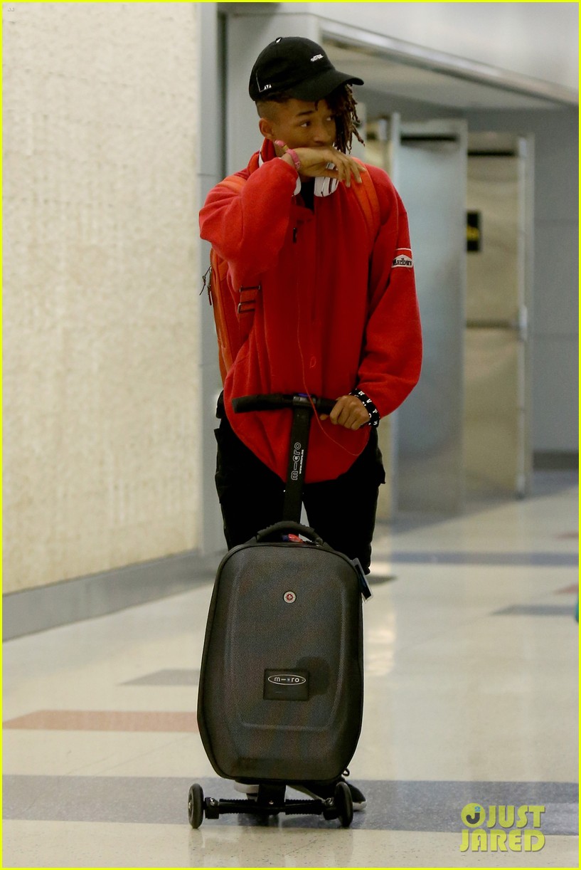 jaden smith rides luggage through airport 11