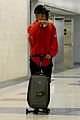 jaden smith rides luggage through airport 11