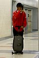 jaden smith rides luggage through airport 13