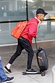 jaden smith rides luggage through airport 16