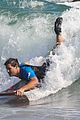 taylor lautner spends sunday catching waves 04