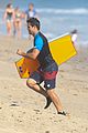 taylor lautner spends sunday catching waves 06