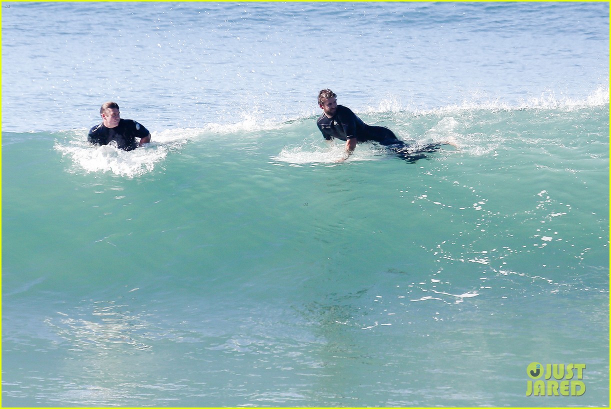 liam hemsworth goes for monday morning surf session with brother luke 04