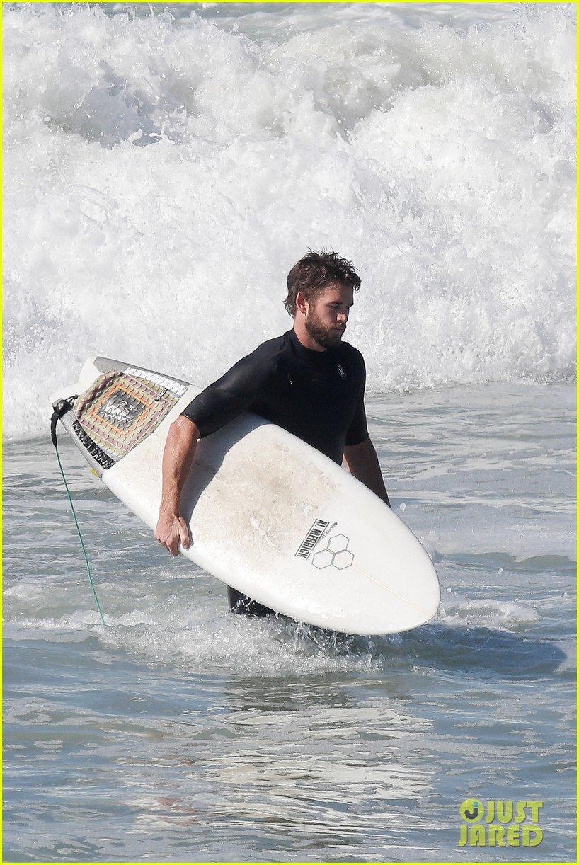liam hemsworth goes for monday morning surf session with brother luke 12