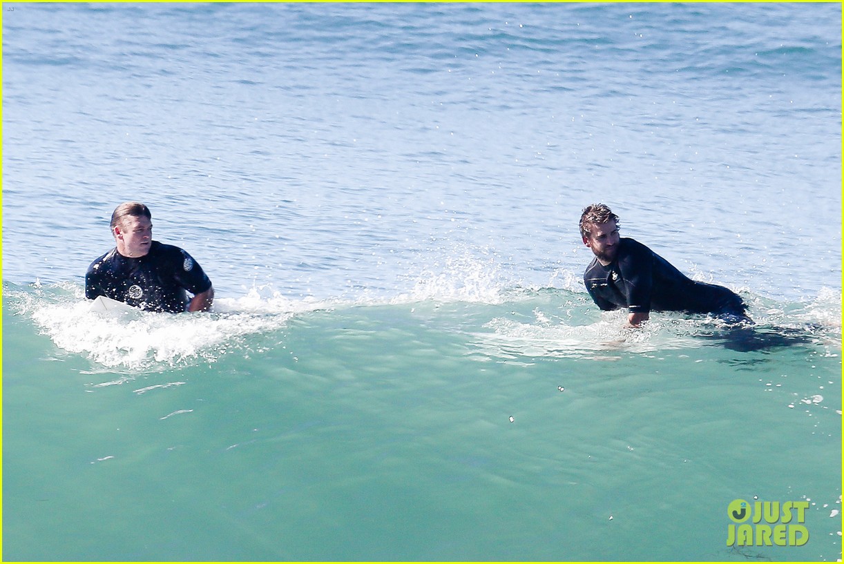 liam hemsworth goes for monday morning surf session with brother luke 16