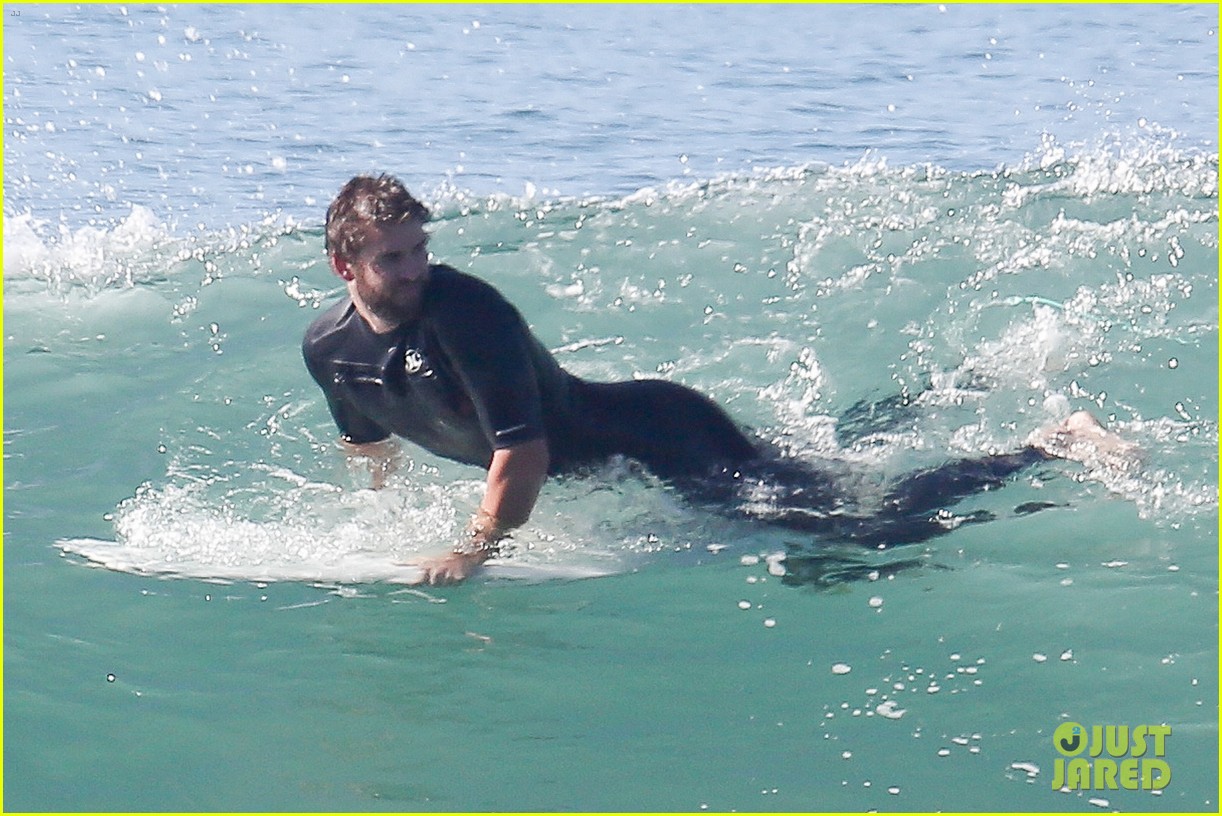 liam hemsworth goes for monday morning surf session with brother luke 17