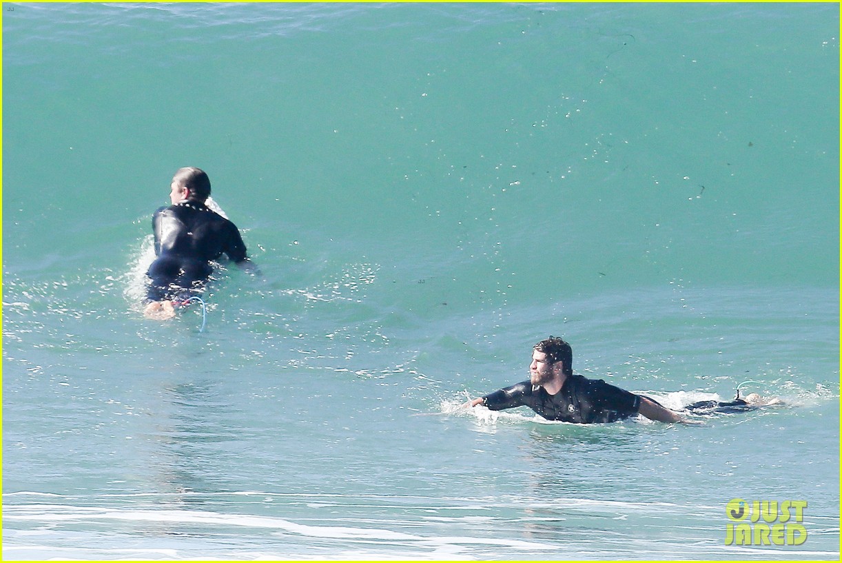 liam hemsworth goes for monday morning surf session with brother luke 24