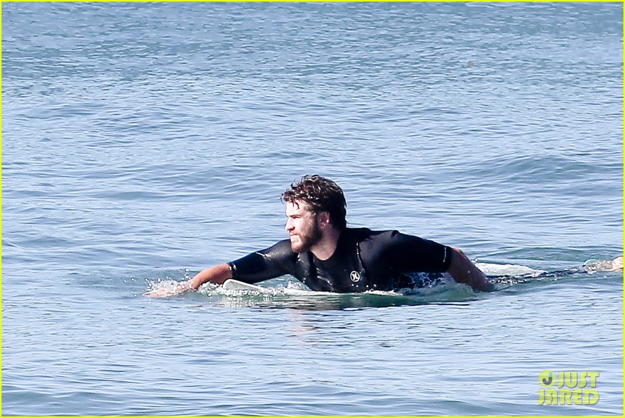 liam hemsworth goes for monday morning surf session with brother luke 30