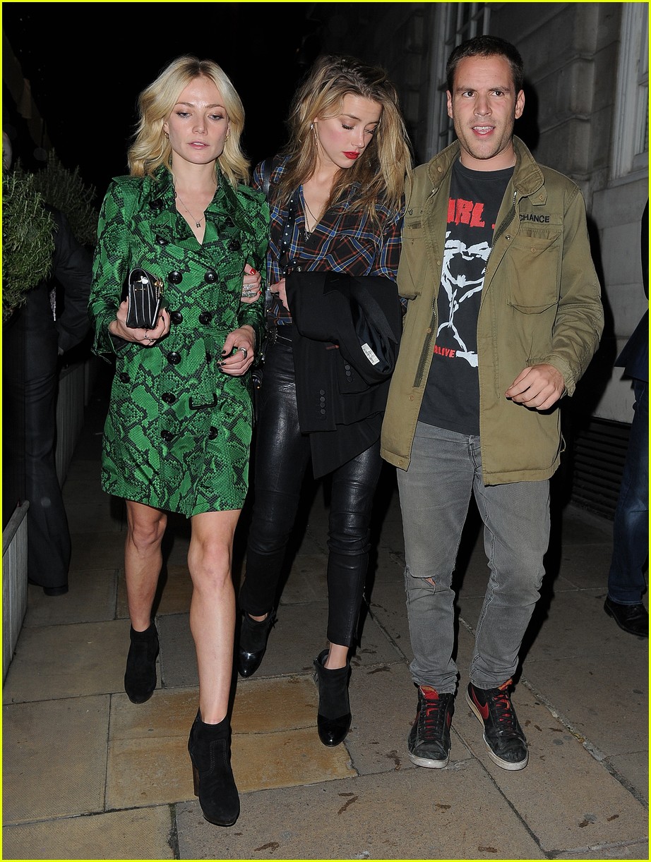 amber heard cara celevingne step out at love magazine party 02
