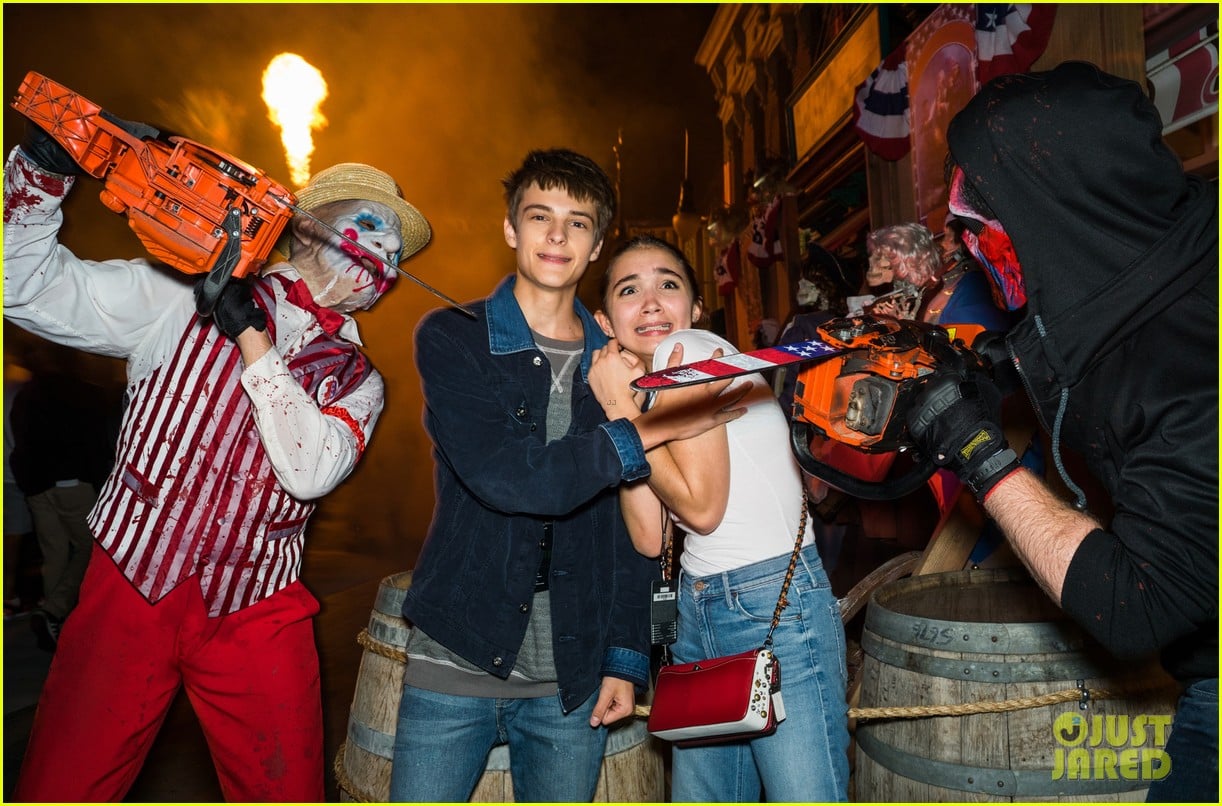 bella thorne tyler posey couple up at halloween horror nights 03