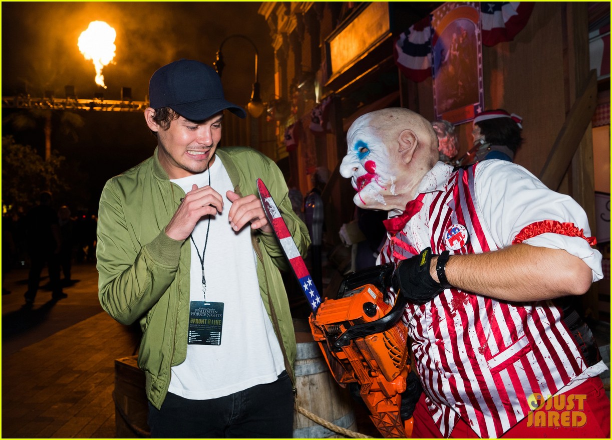 bella thorne tyler posey couple up at halloween horror nights 05