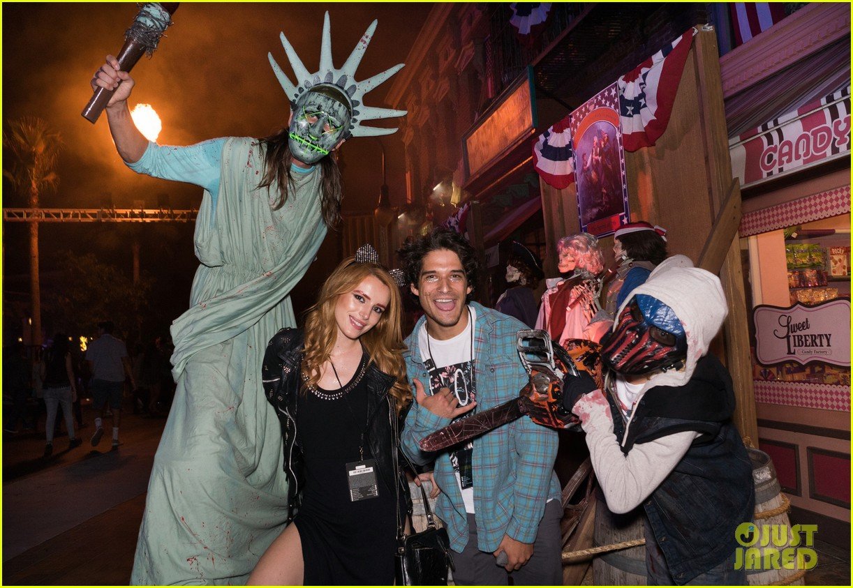 bella thorne tyler posey couple up at halloween horror nights 07