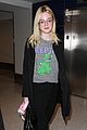 elle fanning brings back the 90s while heading to her flight 02