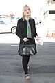elle fanning brings back the 90s while heading to her flight 03