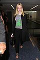 elle fanning brings back the 90s while heading to her flight 08