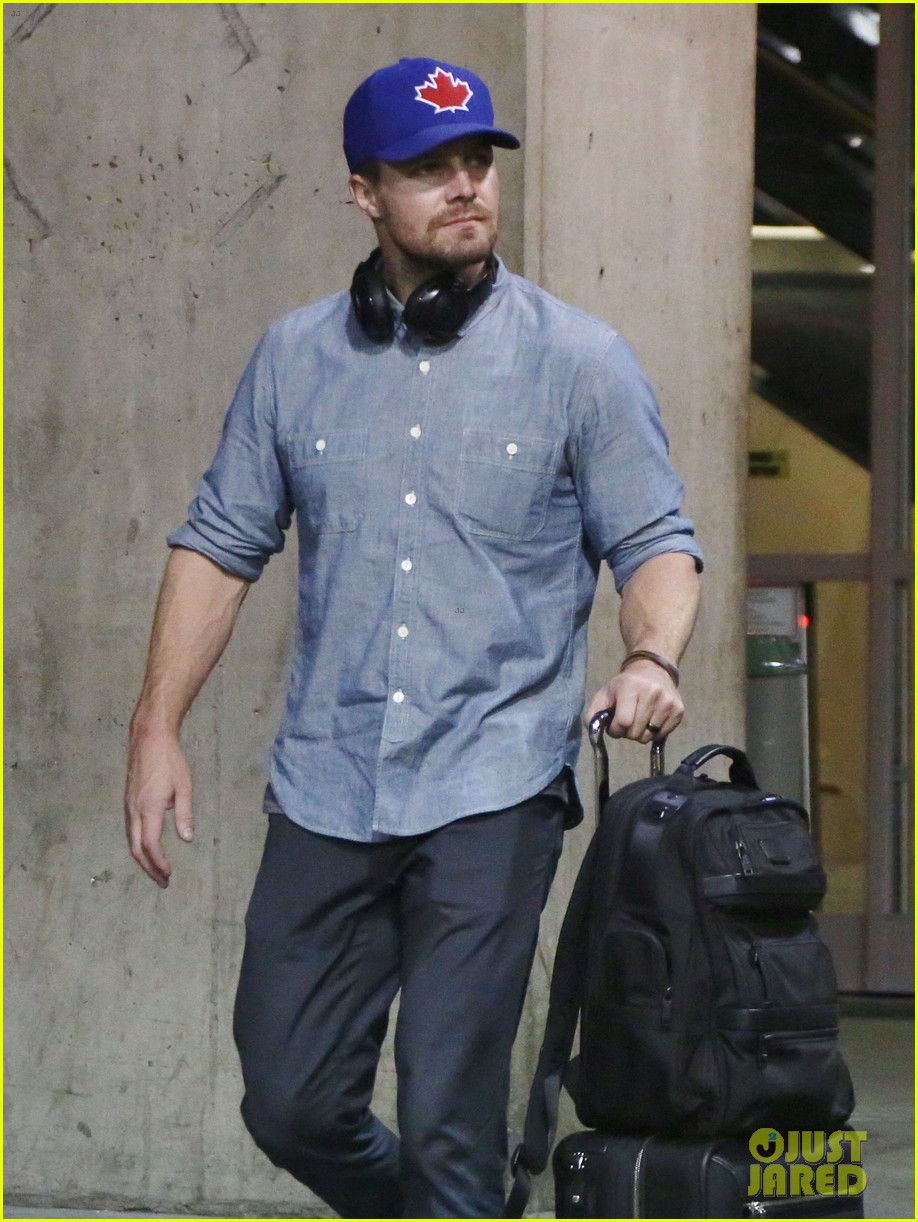 stephen amell grant gustin vancouver airport 02