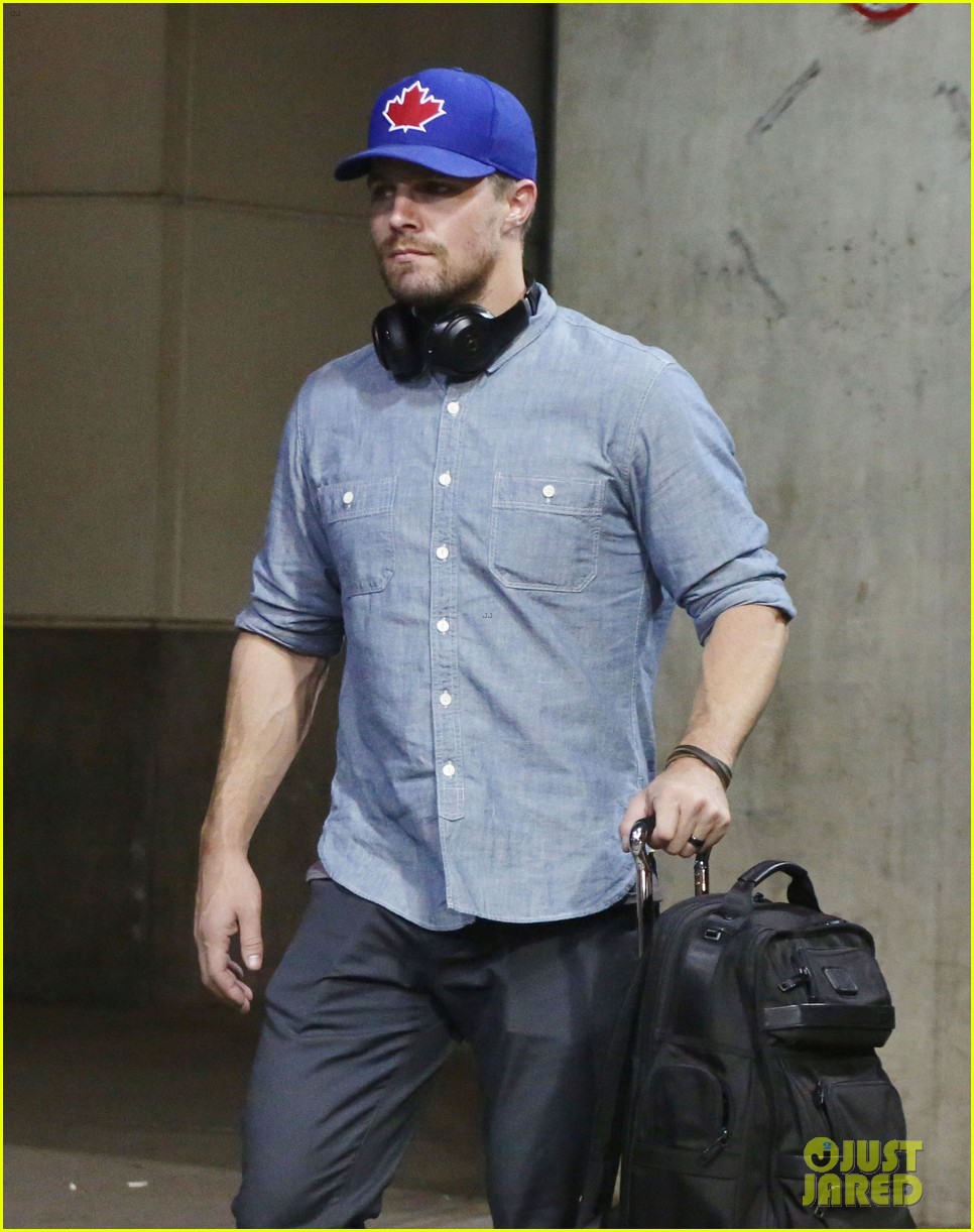 stephen amell grant gustin vancouver airport 07