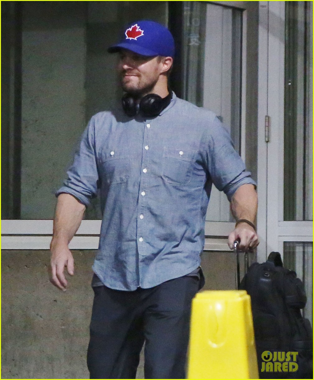 stephen amell grant gustin vancouver airport 08