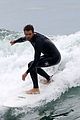 liam hemsworth bares his ripped abs while stripping out of wetsuit 02