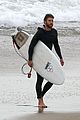 liam hemsworth bares his ripped abs while stripping out of wetsuit 06