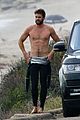 liam hemsworth bares his ripped abs while stripping out of wetsuit 10