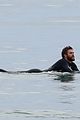 liam hemsworth bares his ripped abs while stripping out of wetsuit 16