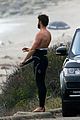 liam hemsworth bares his ripped abs while stripping out of wetsuit 18