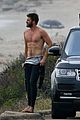 liam hemsworth bares his ripped abs while stripping out of wetsuit 22
